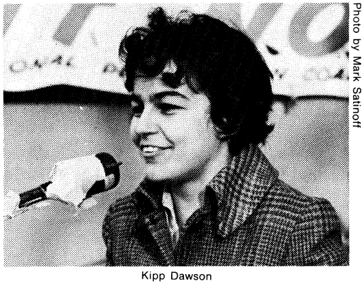 Portrait of Kipp Dawson speaking into a microphone.